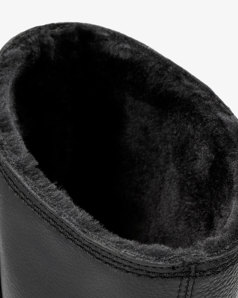 Bambina botas de piel con forro interior de pelo. negro